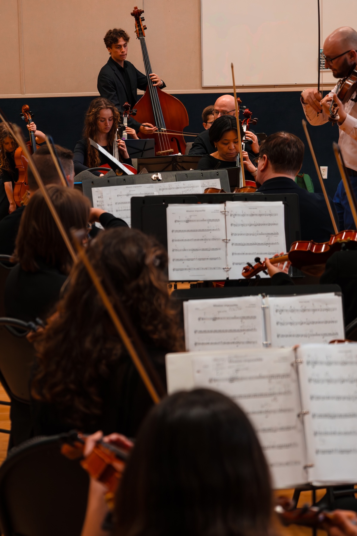The senior ensemble — string musicians ages 16 and up performing on stage.
